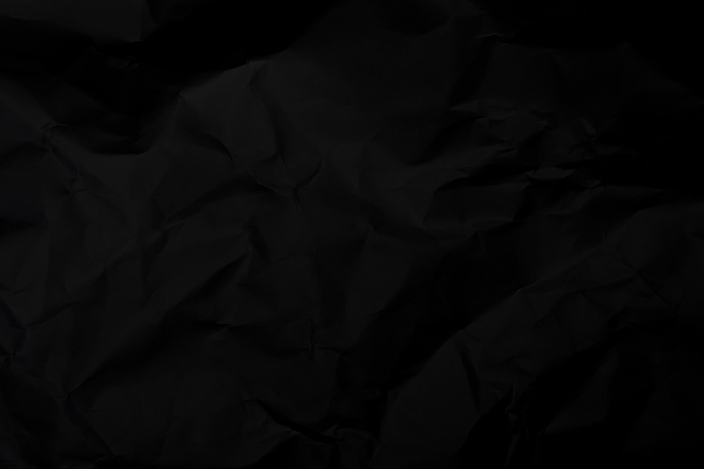 Black Crumpled Paper Texture Background. Black Wrinkled Paper Te